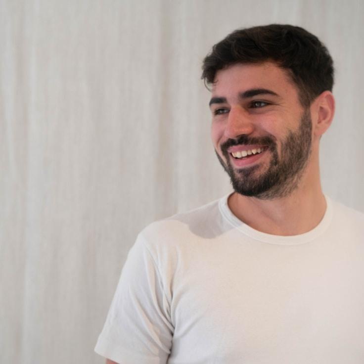 Kaveri Mehta, Lead Design Curator at Still Studio Packet, reviewing corporate floral arrangements